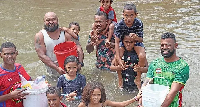 Residents of Savura Road, Wailoku, in the nearby creek on March 28, 2024. Photo: Asenaca Ratu