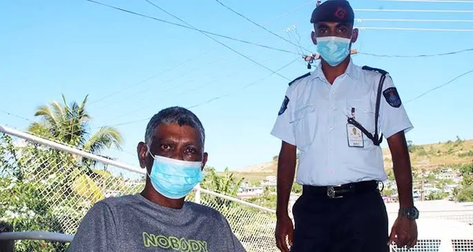 Police Constable Abbu Zahid Shaheed (right), with an injured Vernard James at his home in Lautoka on June 18, 2021. Photo: Police Media Cell
