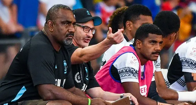 Fiji Airways Fiji men’s rugby sevens head coach Ben Gollings (second from left) makes a point to assistant coach Viliame Satala (left) while halfback Pilipo Bukayaro looks on during the Cup semifinal against New Zealand at the Singapore Sevens on April 9, 2023. Photo: Roslan RAHMAN / AFP 