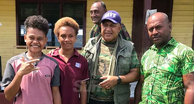 Prime Minister Voreqe Bainimarama with Bua Lomani village headman Ratu Viliame Tagivakatau (right) and villagers at Bua District School in Bua on January 13, 2021. Photo: Shratika Naidu
