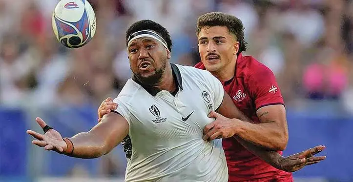 Flying Fijians loosehead prop Eroni Mawi goes for the ball despite being pulled back by the Georgian star winger Davit Niniashvili during the Pool C clash for the Rugby World Cup at Stade de Bordeaux, France, on October 1, 2023. Fiji won 17-12 to edge closer for a quarterfinal spot. Photo: Rugby World Cup 2023