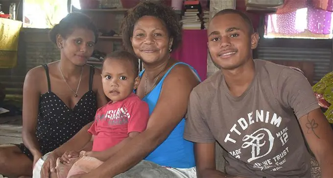 Litea Waqa (middle) holding her youngest son Ilikena Waqa, 2, is with daughter Veniana Marama, 15 (left), and her son Josua Tuiba, 18, at their home at Dratabu Village, Togomasi in Nadi. Photo: Nicolette Chambers