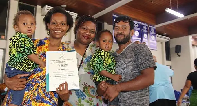 Adi Kula Matairavula (with certificate) and her family after graduating from the FNU Basic Operations in a Call Centre (Level 3) course.Photo: Fiji National University
