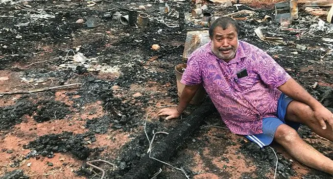 Mahendra Kumar in front of what used to be his home which was burnt down on May 11, 2023. Photo: Shratika Naidu