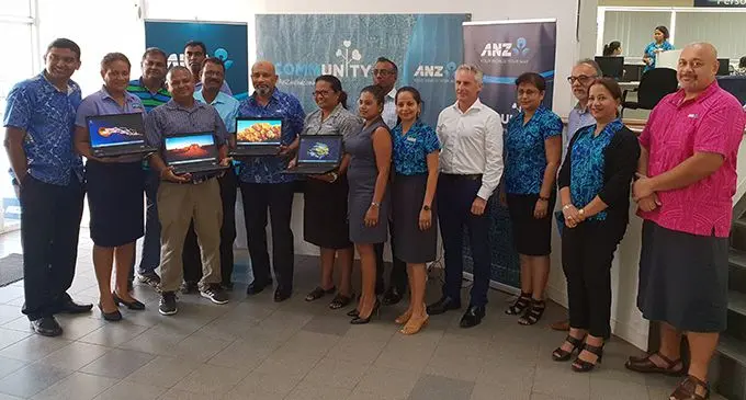ANZ Fiji Country Head Saud Minam (seventh from left), with ANZ Fiji staff members and teachers of the five schools in Ba after the donation of the computers and laptops at the ANZ Fiji, Ba branch on July 11, 2019.   Photo: Nicolette Chambers