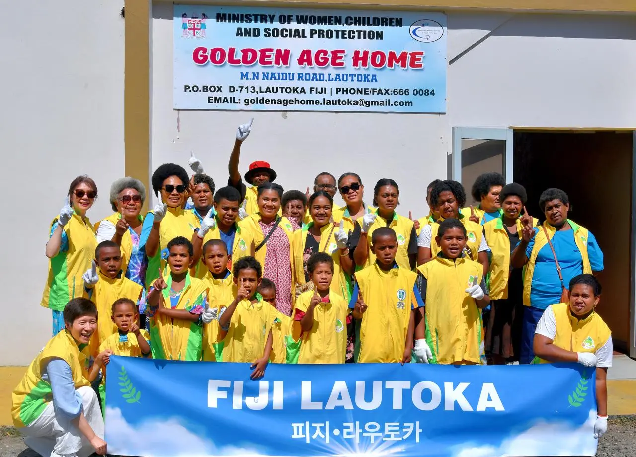  Shincheonji Volunteer Group volunteers marked Fiji Day by bringing smiles, companionship and care to residents of Golden Age Home in Lautoka. Photo: Supplied.
