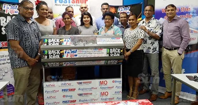 Post Fiji Chief executive officer Anirudha Bansod (right) with his team after the announcement of the 55 winners from the Back-to-School promotion. Photo: Laiseana Nasiga