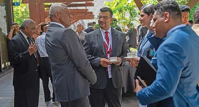 Lawyer Devanesh Sharma (necktie) shares a light moment with Minister for Home Affairs and Immigration Pio Tikoduadua(left), during the Fiji Law Society Annual Convention at the Shangri-la Yanuca Island, Fiji, at Sigatoka on January 20, 2024. Photo: Salote Qalubau