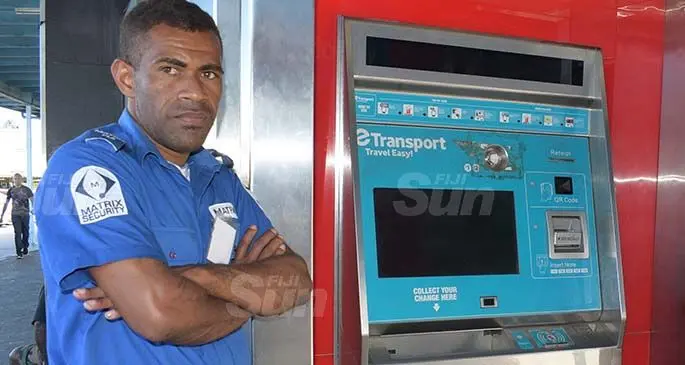 A security guard stands near one of the e-Ticketing machines that was damaged at the Suva Bus Stand and is currently out of order. Photo: Ronald Kumar