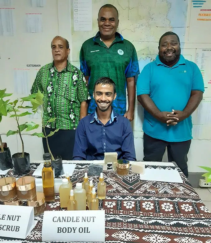  Averyl Avchial (seated), standing from left: Averyl’s dad Abhay Chaudhry with Ministry of Forestry’s Director  Forest Operations Central Eastern George Vuki and Forest Officer Korovou Ilaitia Seroma flank the young  entrepreneur. Photo: Ministry of Forestry