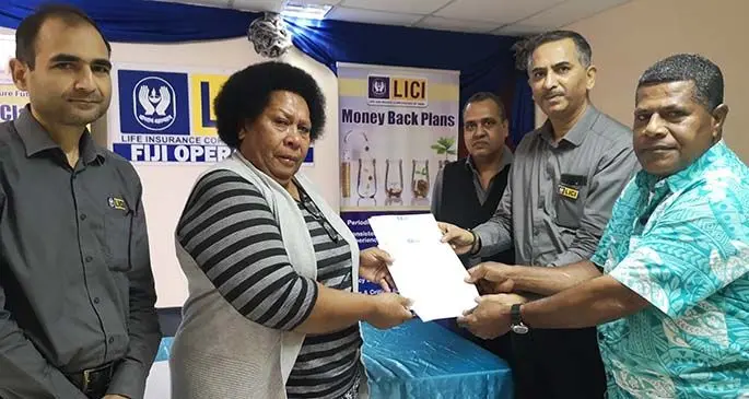 From left: Life Insurance Coproration of India manager underwritng Guatam Kumar, Venaisi Tinai Coriakula, manager for finance, investment and human resources Sanjeev Garg, general manager Fiji operations YS Ashok and Tomasi Coriakula druing the cheque handover on Thursday 11, 2020. Photo: Laiseana Nasiga