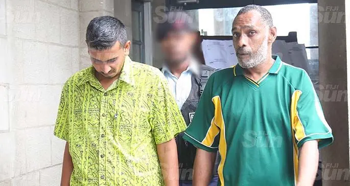 Ashneel Kumar Sharma (left) and Tasir Usman outside the Suva court on May 1, 2020. Photo: Kelera Sovasiga