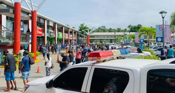 Police monitor crowds near at Damodar City this morning. 