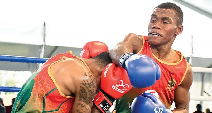 Republic of Fiji Military Forces boxer Keleto Takele (right) misses a punch against Rusiate Qalo in the 57-60kg category finals at the LICI Court in Suva on November 7, 2024. Takele won on points but Police was declared the overall winners. Photo: Ronald Kumar