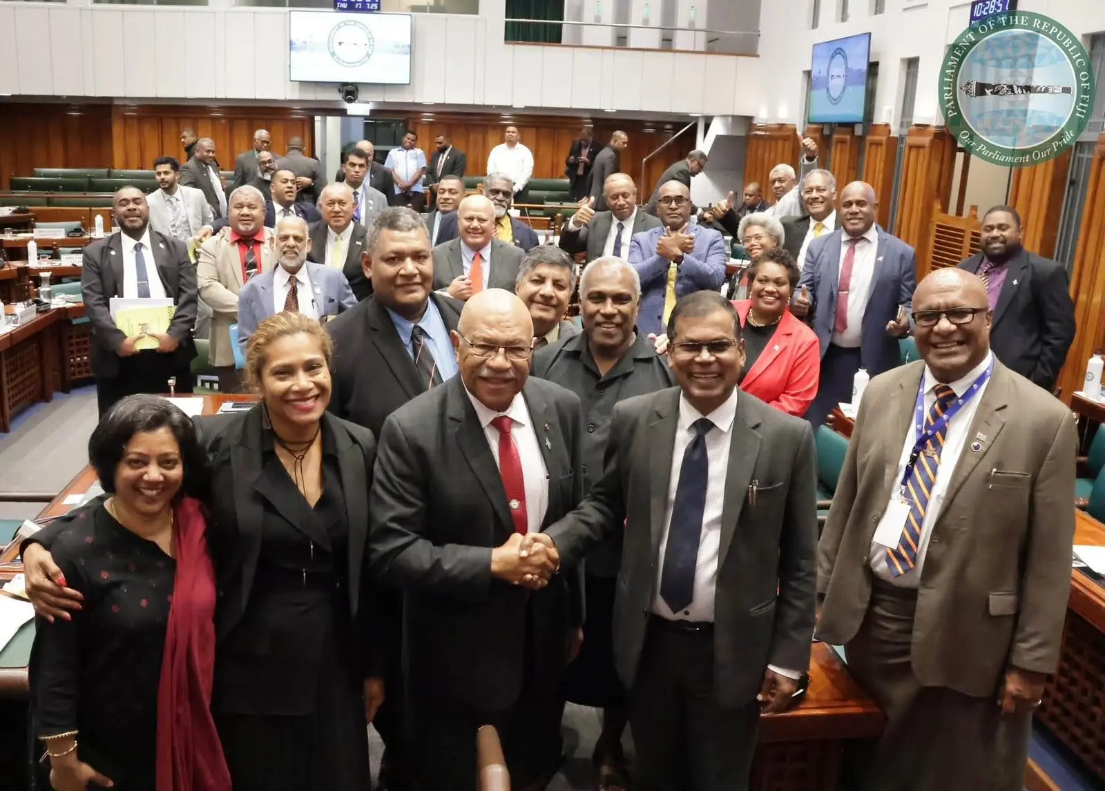 Prime Minister Sitiveni Rabuka congratulates Minister for Finance Biman Prasad after the 2025-2026  National Budget was passed in parliament on July 17, 2025. Photo: Parliament of Fiji