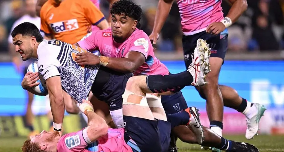 Brumbies fullback Tom Wright is tackled by the Rebels players during their Super Rugby clash at the GIO Stadium in Canberra, Australia, on May 24, 2024. Photo: Canberra Daily 