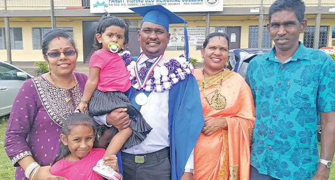 Ravikash Chand with his wife, children and parents at the Pandit Vishnu Deo Memorial College in Lautoka. Photo: Mereleki Nai