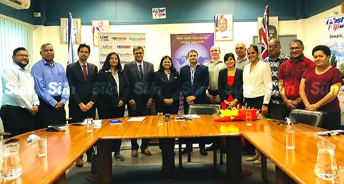 New India Assurance chief operating officer, M Rama (sixth from left), Post Fiji chief executive officer Anirudha Bansod (seventh from left), with organisations’ executives and guests after the agreement signing on February 9, 2022. Photo: Shreeya Verma