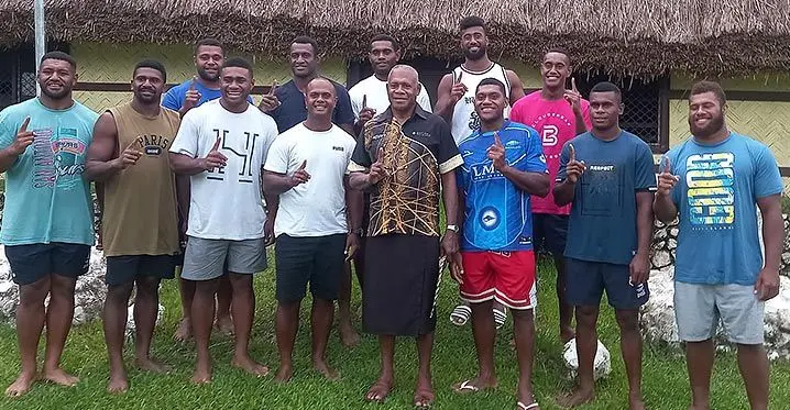 Former Fijian Drua winger Vinaya Habosi (front, third from left) with Methodist Church minister Reverend Saverio Vuata (fifth from left) and his former Drua team-mates after they visited him at Nayawa Village in Nadroga on February 11, 2023. Photo: Supplied