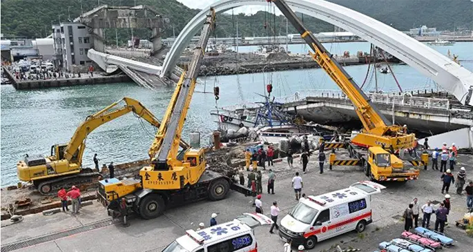 The 150-yard Nanfang’ao bridge in northeastern Taiwan collapsed, sending an oil tanker propelling towards the water, killing at least two people in the fishing boats below.