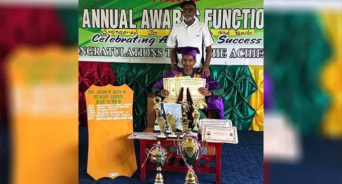 Seaqaqa Muslim Primary School dux Mudassir Saadiq Ali, with his grandfather Shahadat Ali in Macuata on December 9, 2022.