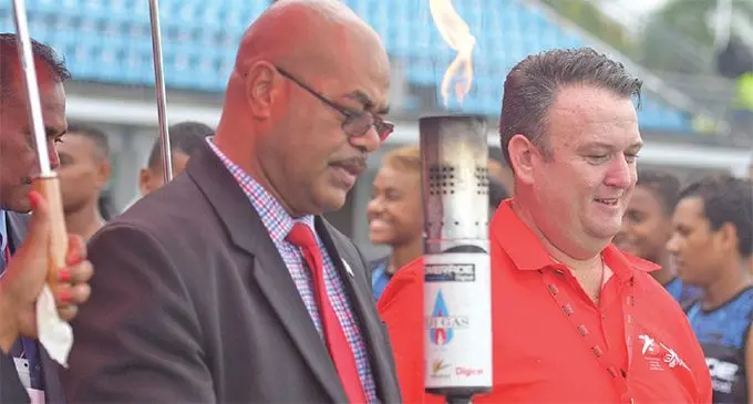 From left: Permanent Secretary for Youth and Sports Maretino Nemani and Coca-Cola Amatil general manager Roger Hare with the Coca-Cola Games touch at the ANZ Stadium, Suva on April 16, 2019. Photo: Ronald Kumar