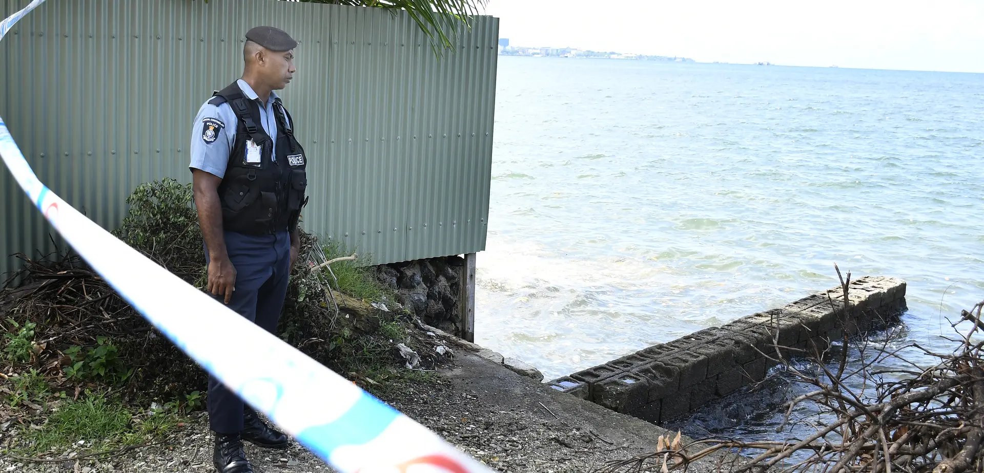 Police stands guard at the scene where the body of the a  police officer was found in Lami on February 23, 2026. 