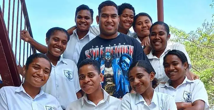 Melbourne Rebels locks Angelo Smith with students of his former school, St Thomas High School in Lautoka on October 19, 2023. Photo: Waisea Nasokia