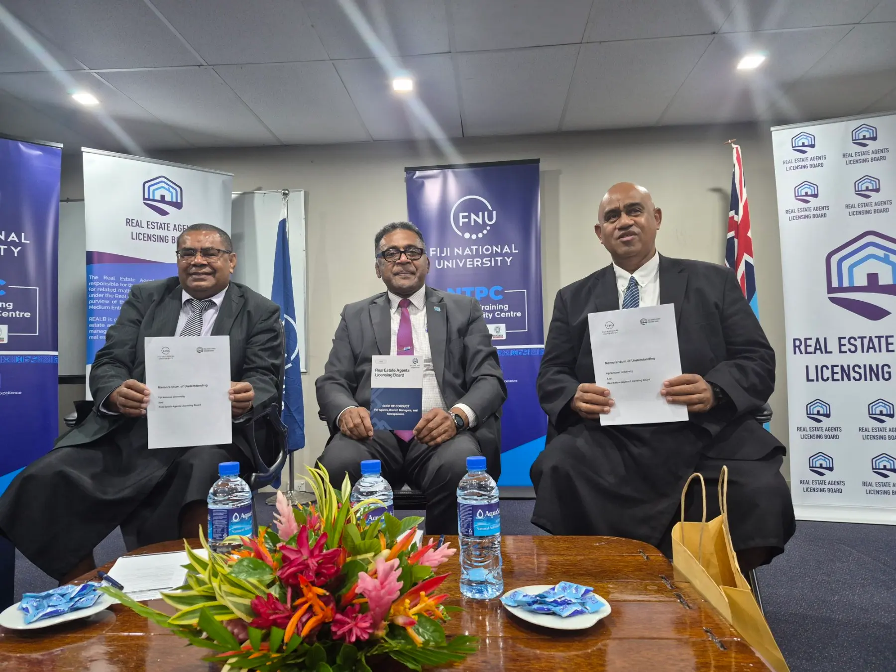 From left - REALB Chairperson and CEO Ilimotama Cawi, Minister for Finance, Commerce and Business Development Esrom Immanuel, and FNU Director f.jpg