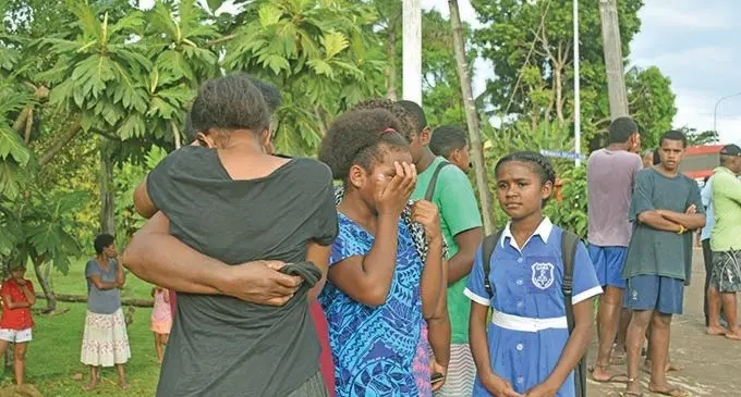 Families  of the deceased and eye witness Sarah Rogers at the scene of the accident on 14th December,2020.   Photo: Laisa Lui 