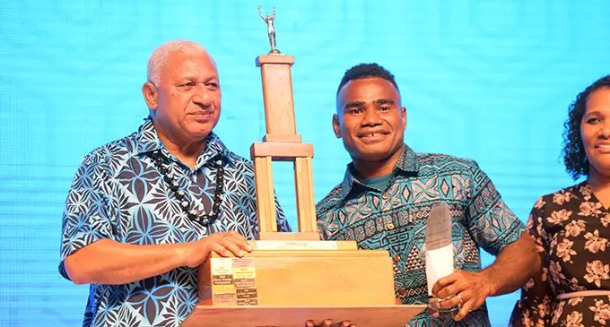 Fiji Airways Fijian 7s halfback Seremaia Tuwai (right) receiving the TattsLotto Sportsman of the Year Award from Prime Minister Voreqe Bainimarama during the Fiji Sports Awards at the Vodafone Arena in Suva on February 15, 2020. Photo: Ronald Kumar