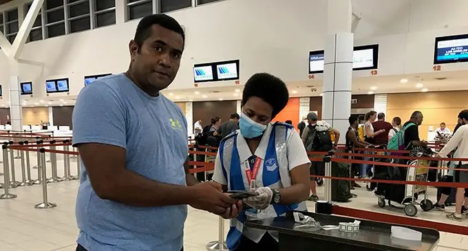 Fiji born US citizen Setareki Qasevakatini is assisted by Masilina Maria at the Nadi International Airport on Monday night. Photo: Waisea Nasokia