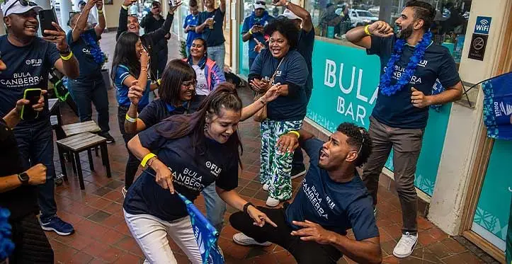 Fijian Drua fans in their Fiji Airways Bula Canberra t-shirts dancing away at the Bula Bar in Canberra, Australia, on April 14. 2023. Photo: Leon Lord