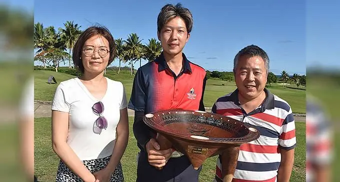 From left: Mum Cynthia Chang, national rep Jia Yi (Tom) Yao and dad Yao Lin after he won the Natadola Open on December 17, 2022. Photo: Waisea Nasokia