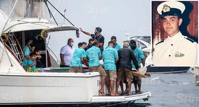 Close family members prepare to release the body of the late captain Jonathan Smith in the burial at seaon August 16 2021. Inset: The late Captain Smith. Photo: Leon Lord