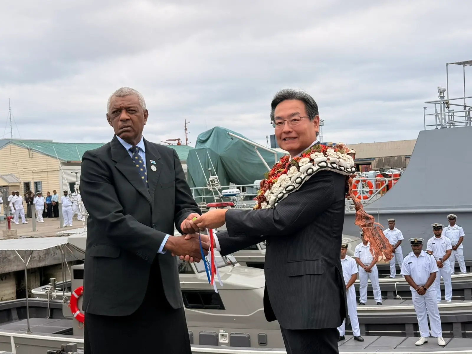 Japan’s Ambassador Extraordinary and Plenipotentiary to Fiji, Hiroshi Tajima, hands over boats to Minister for Defence and Veteran Affairs Pio Tikoduadua at the Stanley Brown Naval Base in Walu Bay, Suva,