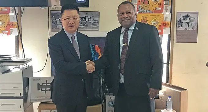 Chinese Ambassador Qian Bo hands over the office equipment to the Minister for Defence, National Security and Foreign Affairs Inia Seruiratu at the association’s headquarters in Walu Bay. Photo: Neelam Prasad