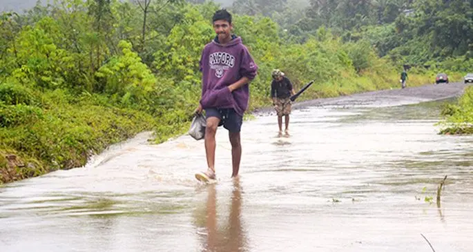 Valenicina and Matata settlement residents of Lami cross the flooded bridge on October 8, 2019. Photo: Ronald Kumar