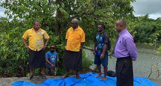 Minister for Rural and Maritime Development and Disaster Management Hon. Inia Seruiratu and Commissioner Eastern Division Mr. Vitale Varo with Moturiki chief Ratu Waisale Draunidalo during the handover of equipment to villagers of Moturiki at the Waidalice Landing in Tailevu yesterday