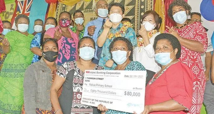Korean Ambassador to Fiji Young-kyu Park with Nabua Primary School head teacher Filipe Gonedua, teachers and officials during the cheque handover on 22 September, 2021. 