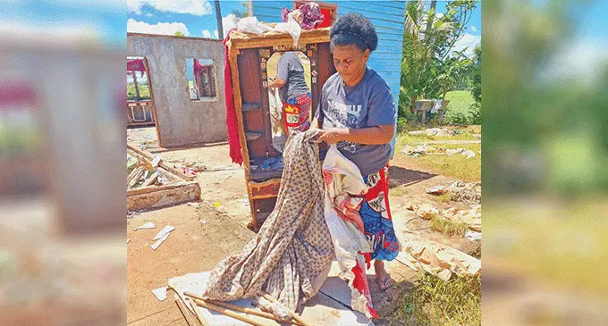 Nina Taiviu, 46, folding and drying some of the remaining clothes following the whirlwind at Sarava, Labasa on March 19, 2025. Photo: Sampras Anand.