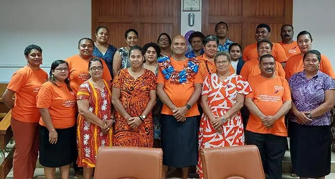 Commissioner Western, Apolosi Lewaqai (with garland) and Empower Pacific chief executive officer, Patrick Morgam, (front row, second from right) with the staff of Empower Pacific, Government representatives and activists following the launch of the 16 days of Activism Against Gender Based Violence at the Lautoka City Council Chambers on November 25, 2022. Photo: Nicolette Chambers.