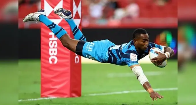 Fiji Airways Fijian 7s rising winger Vuiviwa Naduvaco dives over to score one of his two tries against New Zealand in the Cup final of the Singapore 7s on April 10, 2022. Fiji won 28-17. Photo: Roslan Rahman / AFP