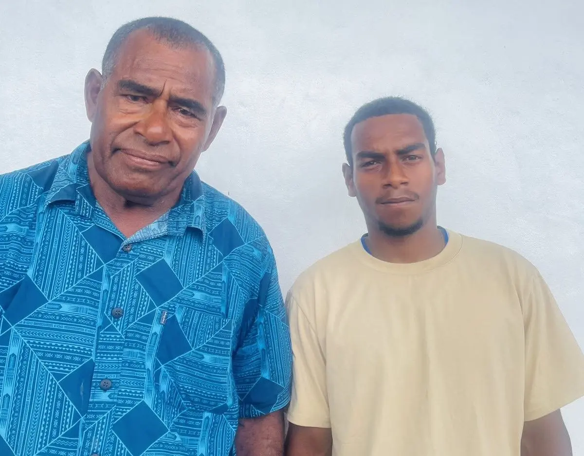 Waisake Rawaitale (left) with his grandfather, while checking his Year 12 result on Friday, January 9. 