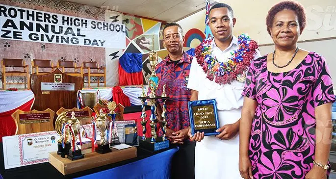 Marist Brothers High School Head Principal Award recipient Reifa Buinimasi with parents Manu and Tema Buinimasi and his trophies after the prize giving ceremony on October 11, 2019. Photo: Kelera Sovasiga