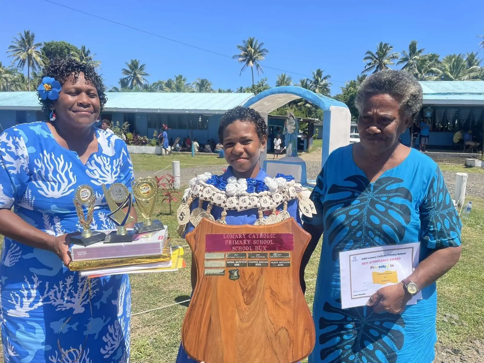 From left, Vaseva's mom Salote Matanayawa, graduate Vaseva Cataka with her grandmother, Adi Emi Naidoleca. 