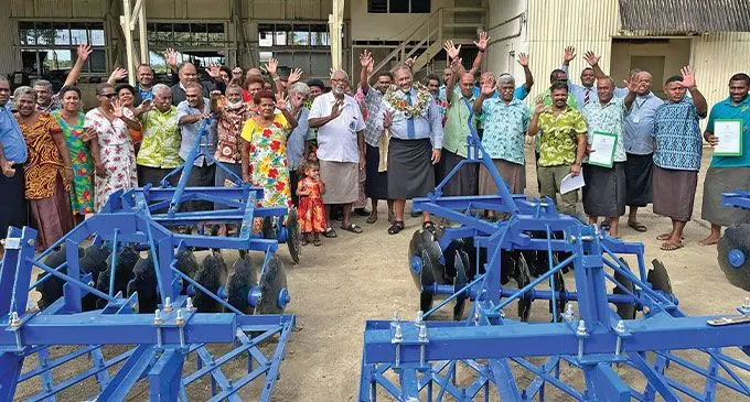 Deuba Farmers Coorperative members and families with the Minister for Rural and Maritime Development Sakeasi Ditoka (with garland), after receiving farming implements in Navua.