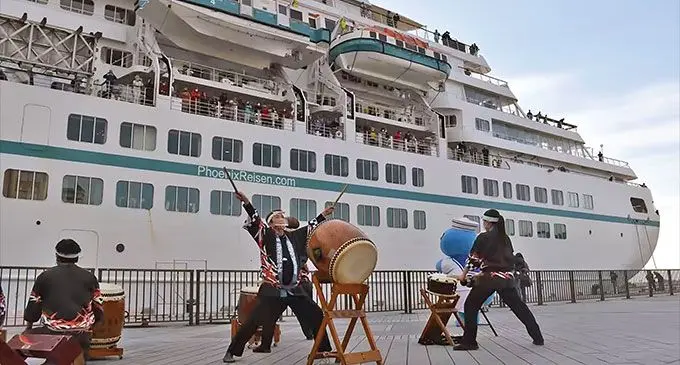 Japanese taiko drum players greet the Amadea cruise ship at a port in Shizuoka, Japan. Photo: Hiroto Okura