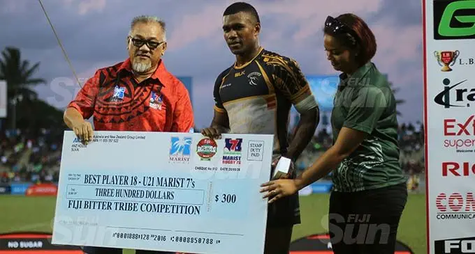 Nacani Boginisoko (centre) of Dominion Brothers receives the under 21 best player award during the 44th Fiji Bitter Marist 7s at ANZ Stadium, Suva, on September 26, 2020. Photo: Kelera Sovasiga