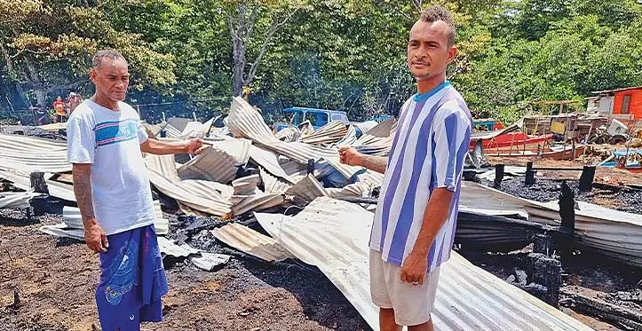 Home owners Felix Elder and nephew Mike Elder, at the ruins of the two houses destroyed in a fire on November 28, 2023. Photo: Sampras Anand